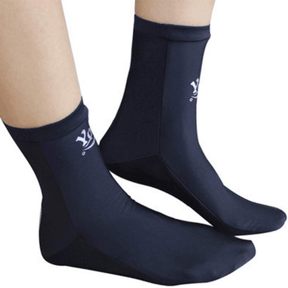 A pair of black lycra dive socks being worn on feet, shown from the side against a white background. The socks have a smooth, snug fit with a small white logo near the top of the ankle.