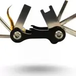 Compact multi-tool with fold-out dive wrenches and screwdriver heads for scuba gear adjustments.